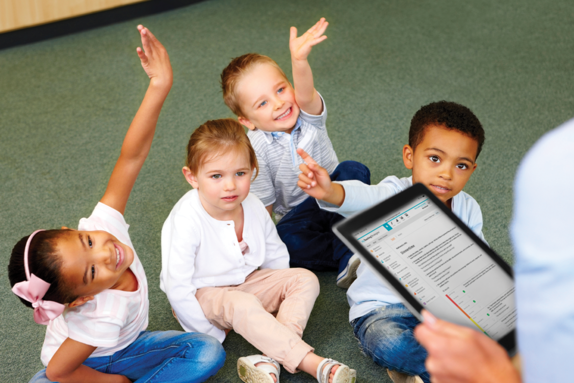 Teacher with tablet and children ITE teach