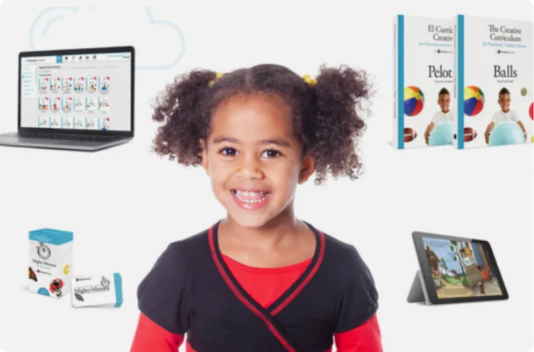 young girl smiling surrounded by a laptop tablet mighty minute box creative curriculum books