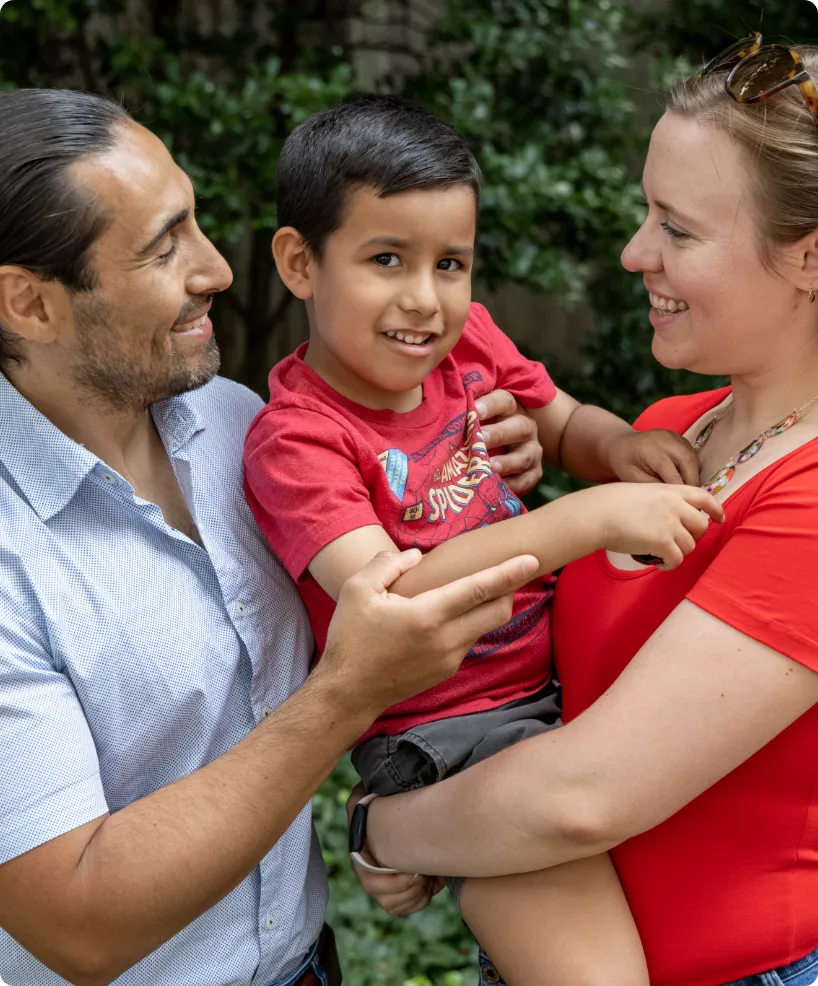 happy child with parents outdoors