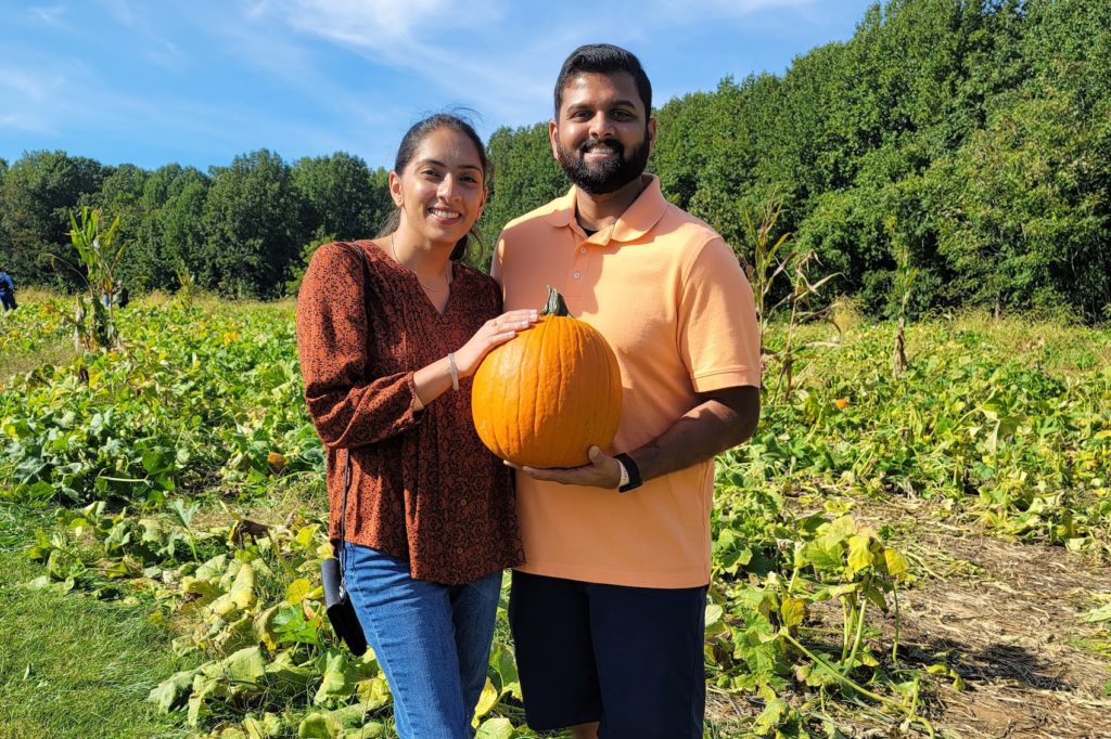 Arpen and his wife in a pumpkin patch