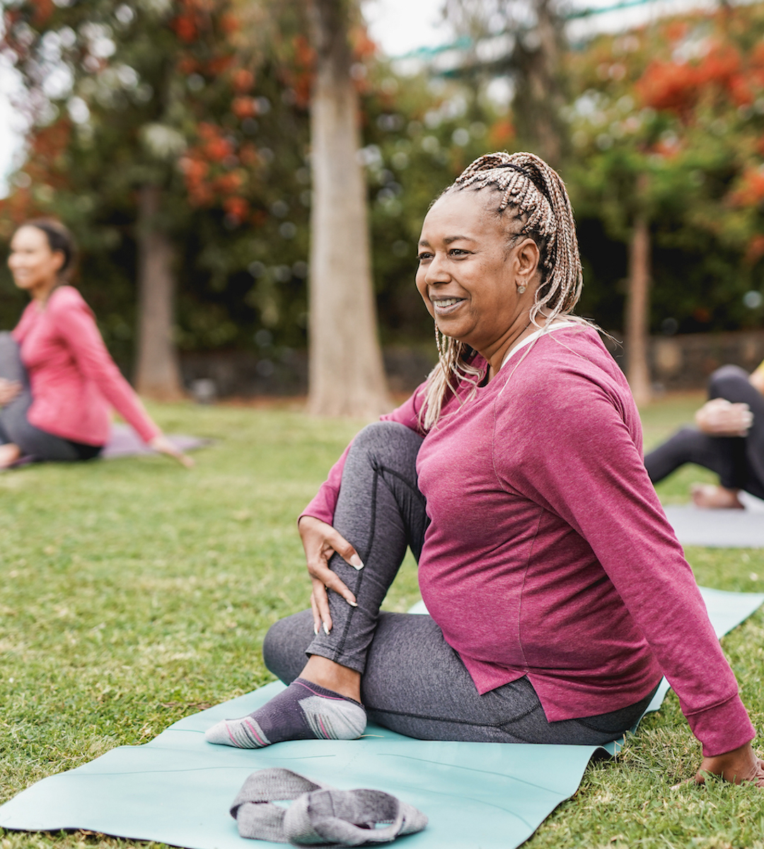 Teacher doing yoga outdoors.