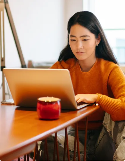 woman at laptop in her living room